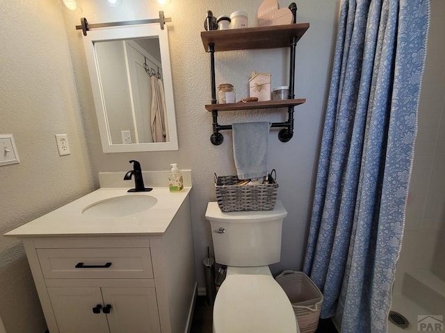 2602 3rd Ave, Pueblo, CO 81003 - full bathroom featuring vanity, a shower with shower curtain, and a textured wall