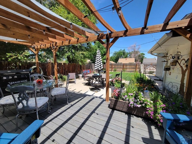 2602 3rd Ave, Pueblo, CO 81003 - deck with outdoor dining space, a pergola, and a fenced backyard
