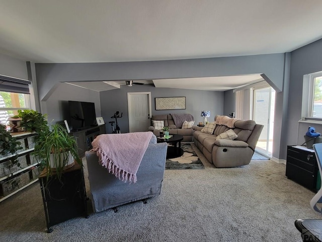 2602 3rd Ave, Pueblo, CO 81003 - carpeted living room featuring plenty of natural light, arched walkways, and a ceiling fan