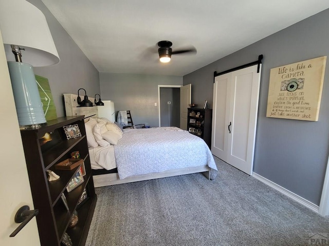 2602 3rd Ave, Pueblo, CO 81003 - bedroom featuring carpet, ceiling fan, and a barn door