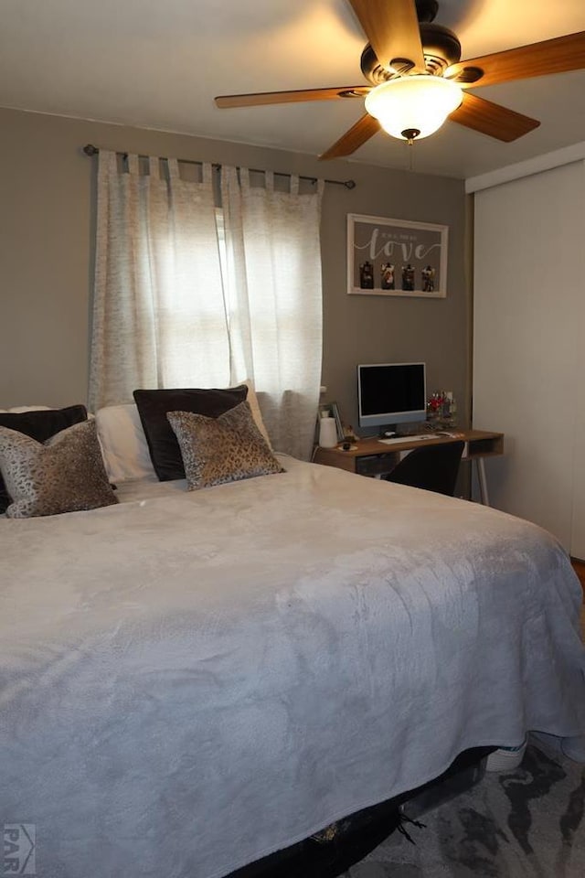 bedroom with a closet and a ceiling fan