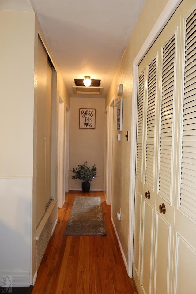 hall with wood finished floors