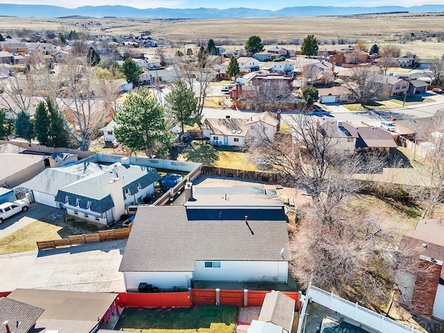 birds eye view of property with a mountain view and a residential view