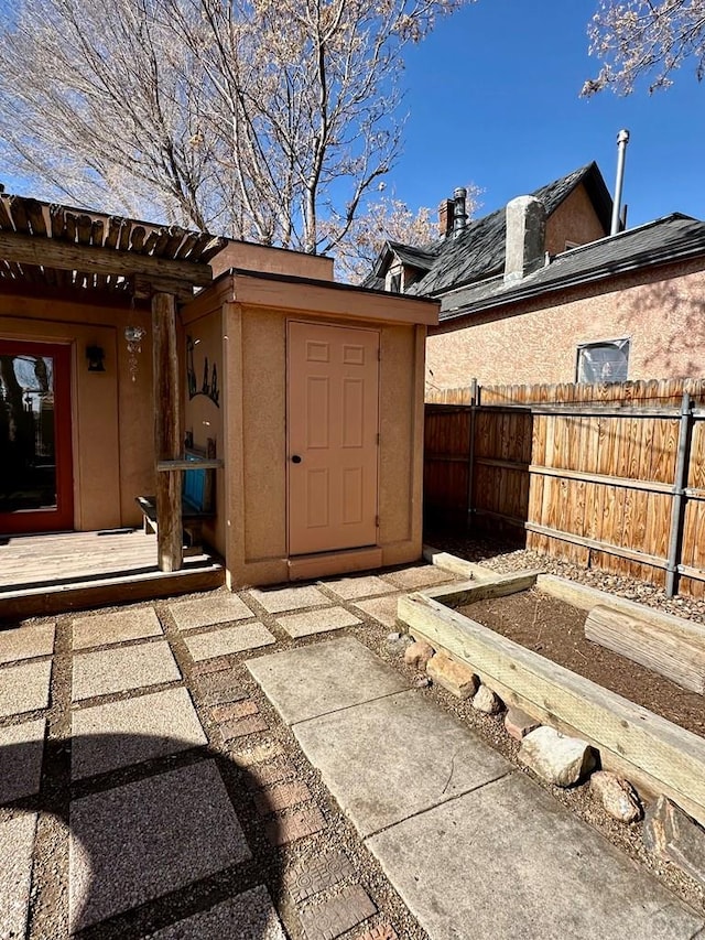 view of outdoor structure with fence