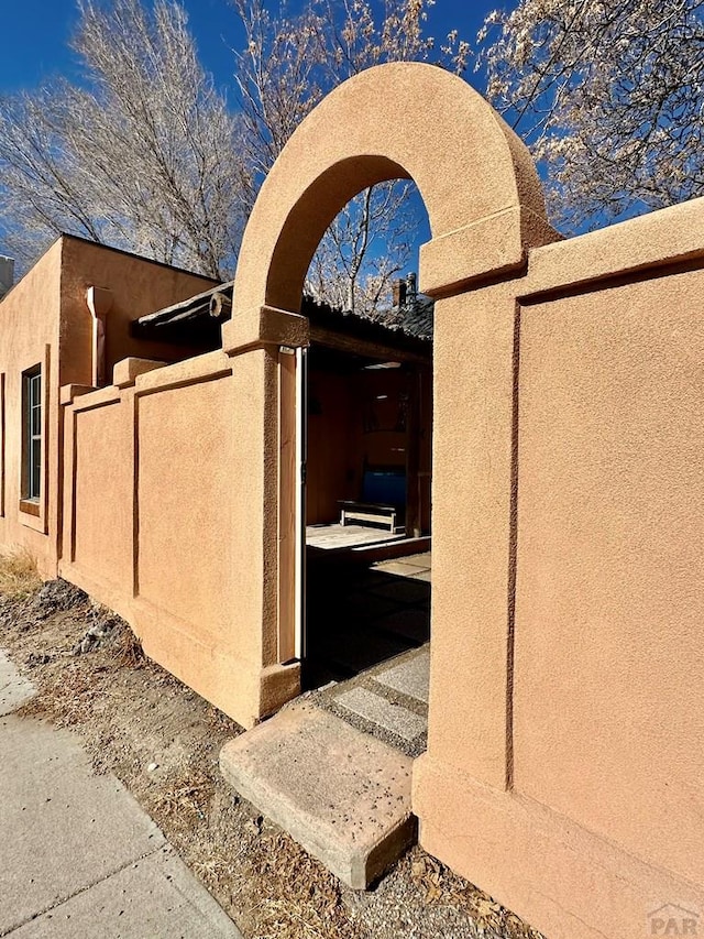 view of side of property featuring stucco siding