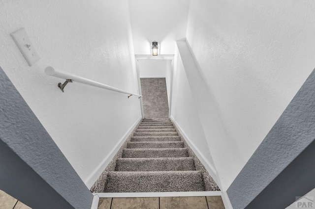2720 E 8th St, Pueblo, CO 81001 - stairs featuring a textured wall and baseboards