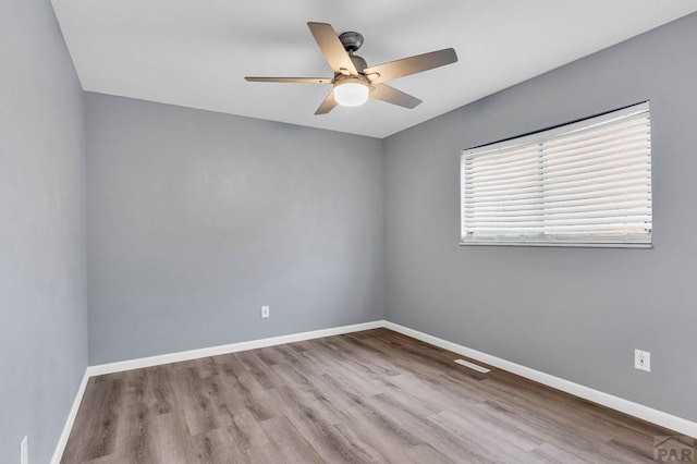 2720 E 8th St, Pueblo, CO 81001 - unfurnished room featuring a ceiling fan and wood finished floors