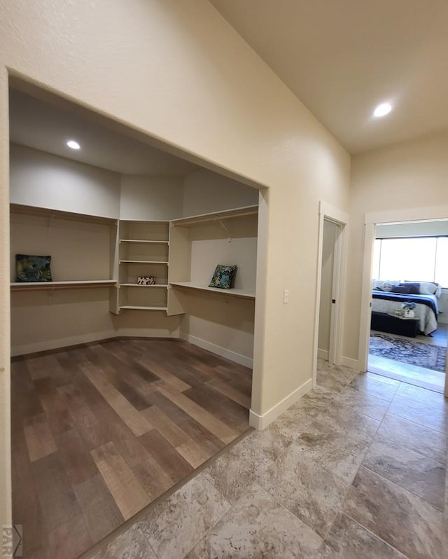 interior space with recessed lighting and baseboards