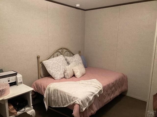 bedroom with crown molding