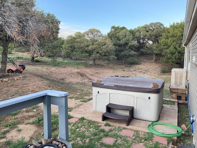 view of yard with a hot tub