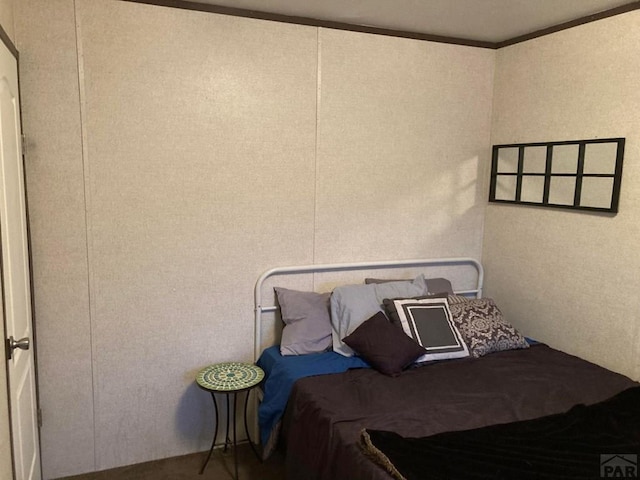 bedroom with ornamental molding