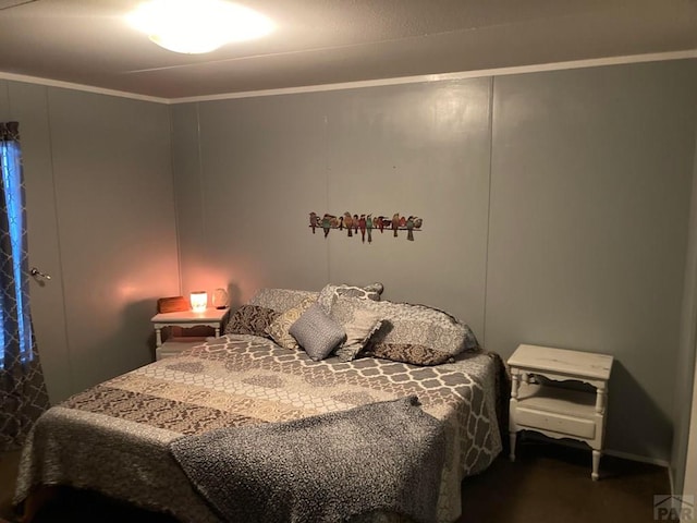 bedroom featuring crown molding