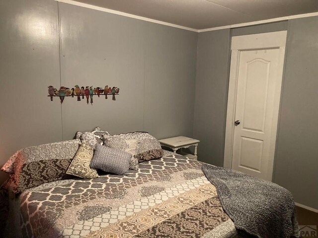 bedroom featuring crown molding
