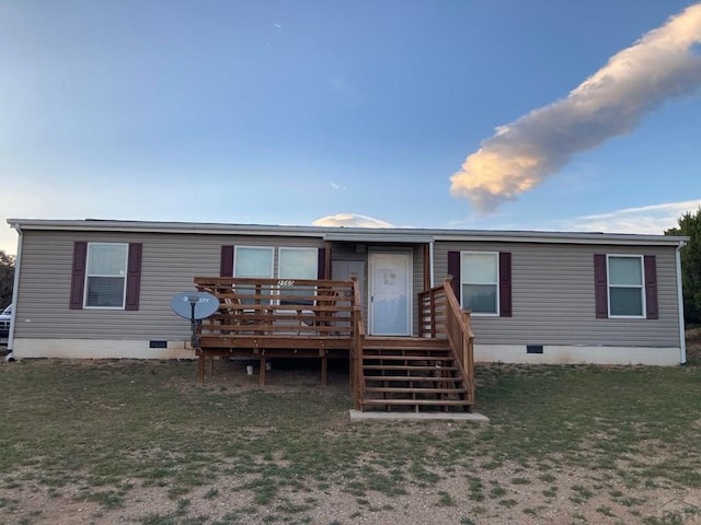 view of front of property featuring crawl space, stairway, and a deck