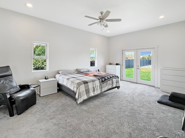 bedroom with recessed lighting, access to exterior, carpet flooring, and french doors