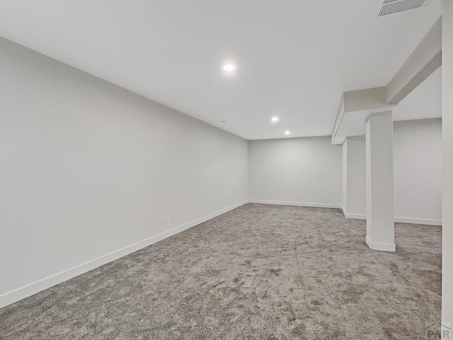 finished below grade area with recessed lighting, visible vents, carpet flooring, and baseboards