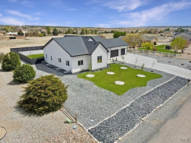 birds eye view of property with a residential view