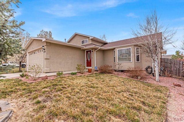 single story home with stucco siding, driveway, a front lawn, a garage, and fence
