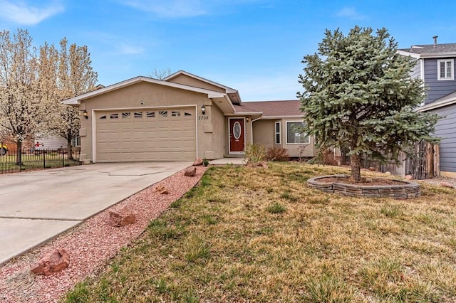 single story home featuring a garage, stucco siding, fence, a front lawn, and concrete driveway