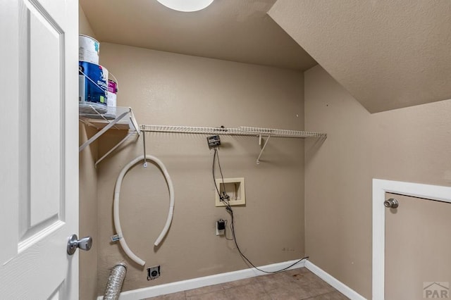 laundry room featuring electric dryer hookup, baseboards, a textured ceiling, laundry area, and hookup for a washing machine