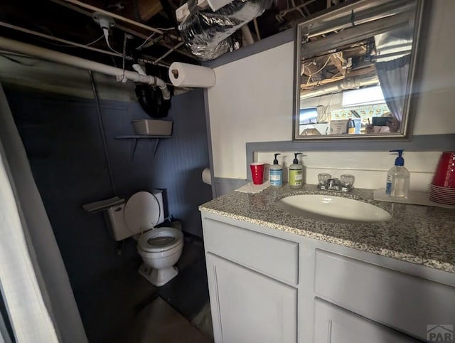 bathroom with toilet and vanity