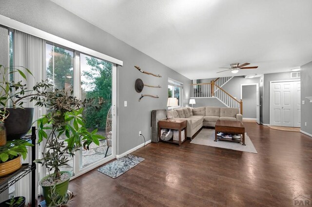 7365 Far Hill Dr, Colorado Springs, CO 80922 - living room featuring wood finished floors, stairs, a ceiling fan, and baseboards
