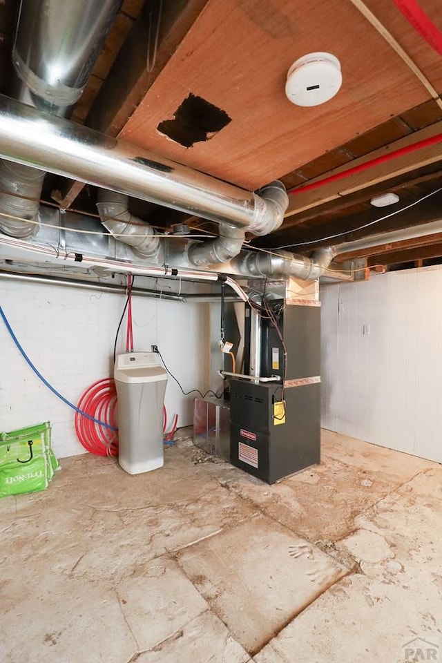 unfinished below grade area featuring heating unit