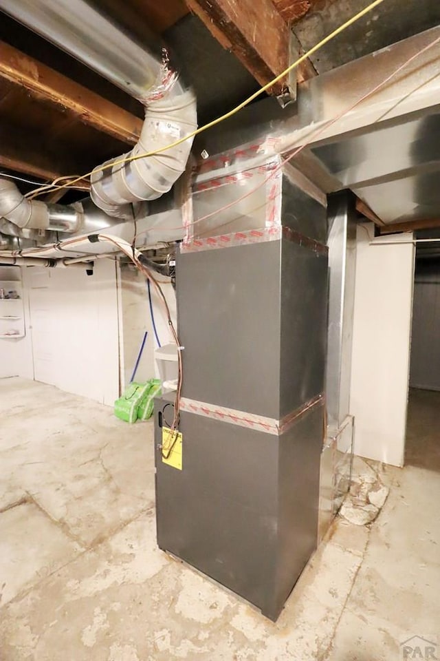 utility room with heating unit