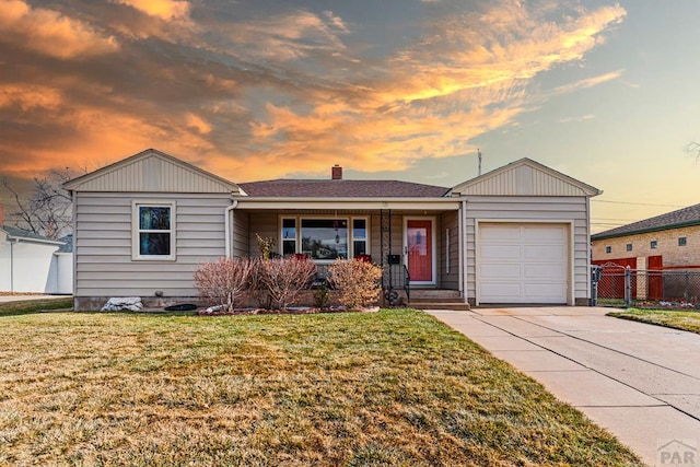 ranch-style home with an attached garage, driveway, a chimney, and a front yard