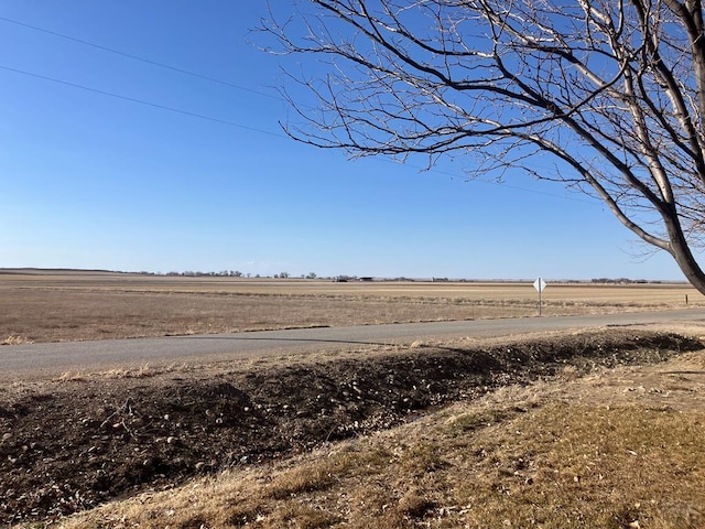 view of yard with a rural view