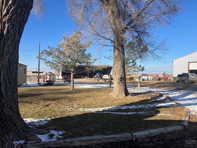 view of yard featuring a garage