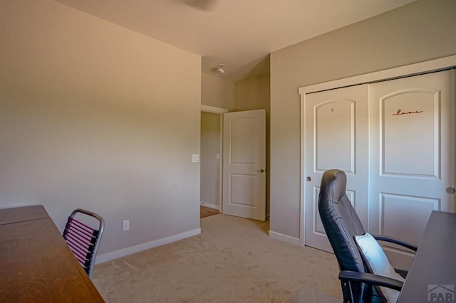 unfurnished office with light colored carpet and baseboards