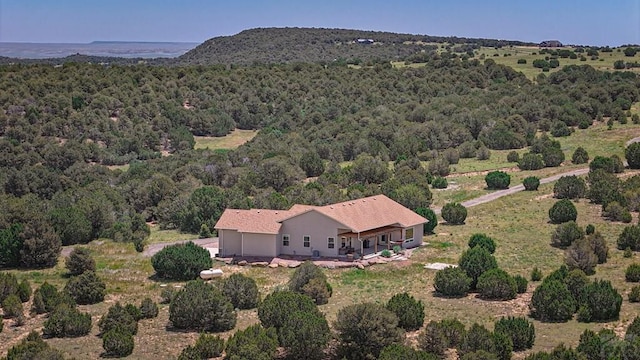 aerial view featuring a forest view
