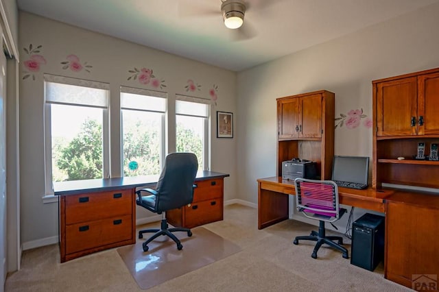 office featuring light carpet and baseboards