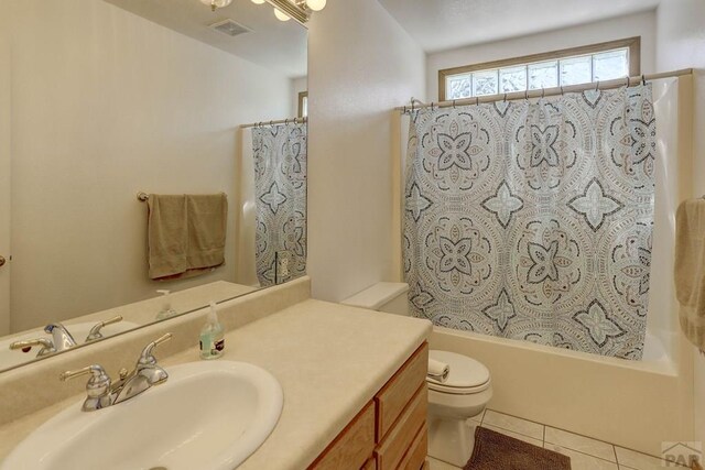 full bath with shower / bath combination with curtain, visible vents, toilet, vanity, and tile patterned floors