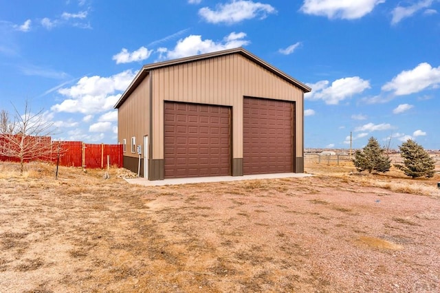 detached garage with fence