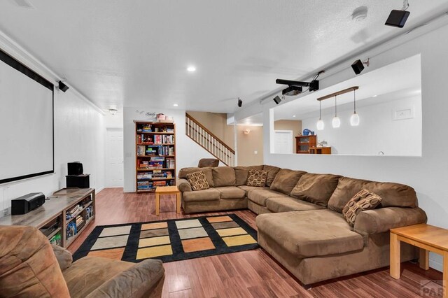 living room featuring stairway, wood finished floors, and recessed lighting