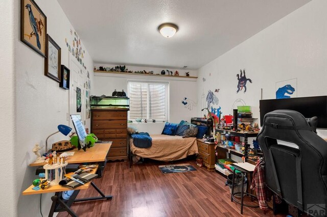 bedroom with wood finished floors