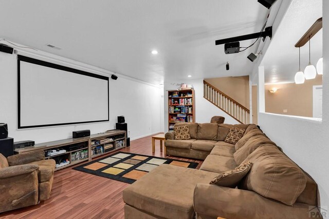 home theater featuring wood finished floors, visible vents, and recessed lighting