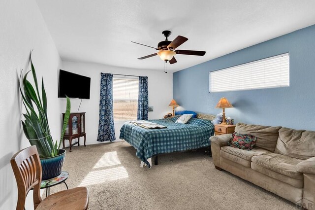 carpeted bedroom featuring a ceiling fan