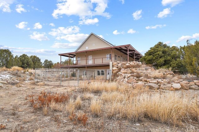 back of property with fence