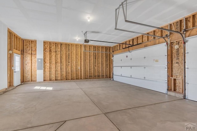 garage featuring a garage door opener and electric panel