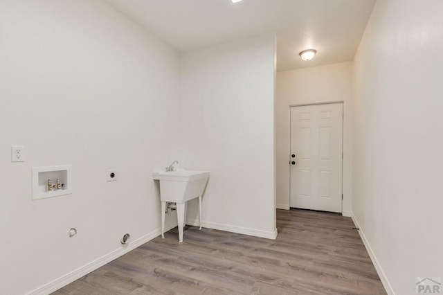 washroom featuring laundry area, washer hookup, light wood-type flooring, and electric dryer hookup