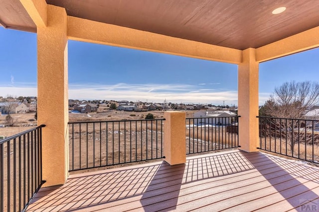 wooden deck featuring a residential view