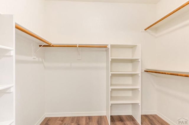 spacious closet with wood finished floors