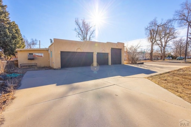 garage featuring driveway