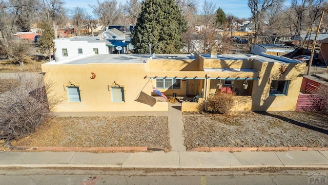 view of front of property featuring a residential view and stucco siding