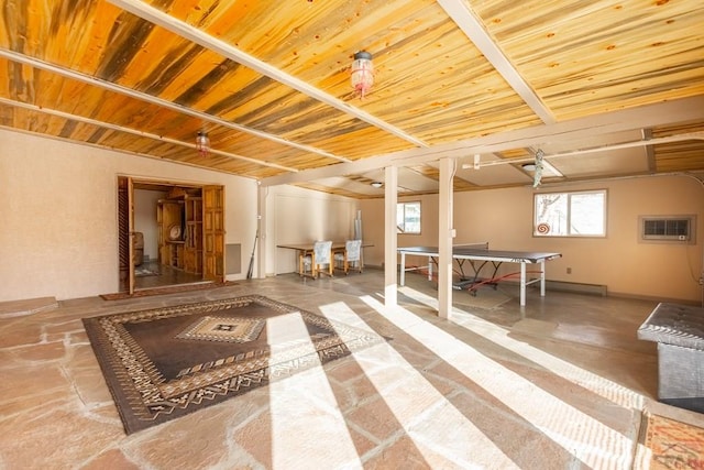 below grade area with wood ceiling and a wall unit AC