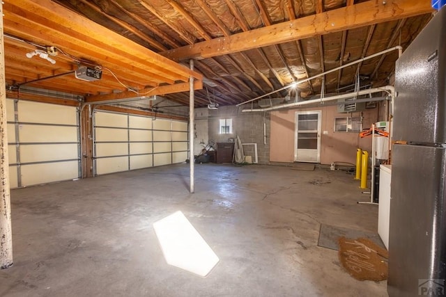 garage featuring a garage door opener and heating unit