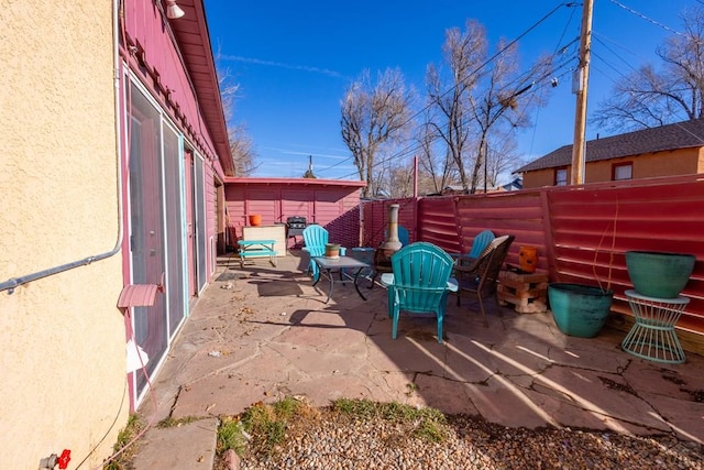 view of patio featuring fence